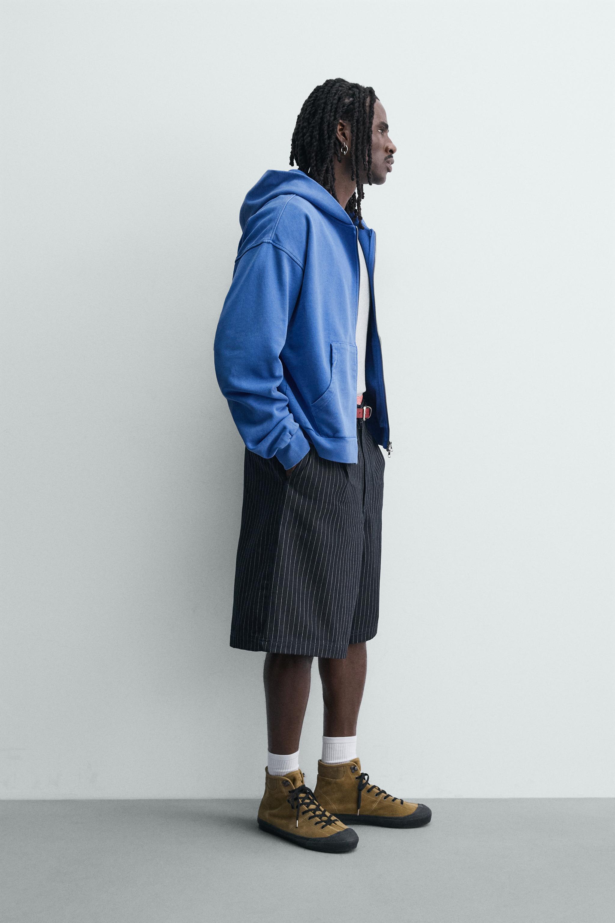 PINSTRIPED PLEATED SHORTS